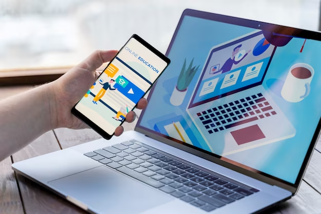 Close up of man with smartphone and laptop indoors